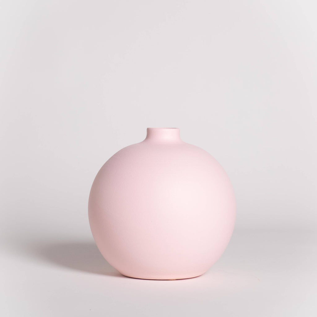 Pink vase on a light gray background