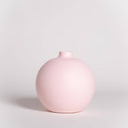 Pink vase on a light gray background