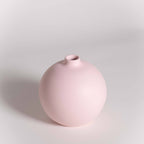 Pink vase on a light gray background